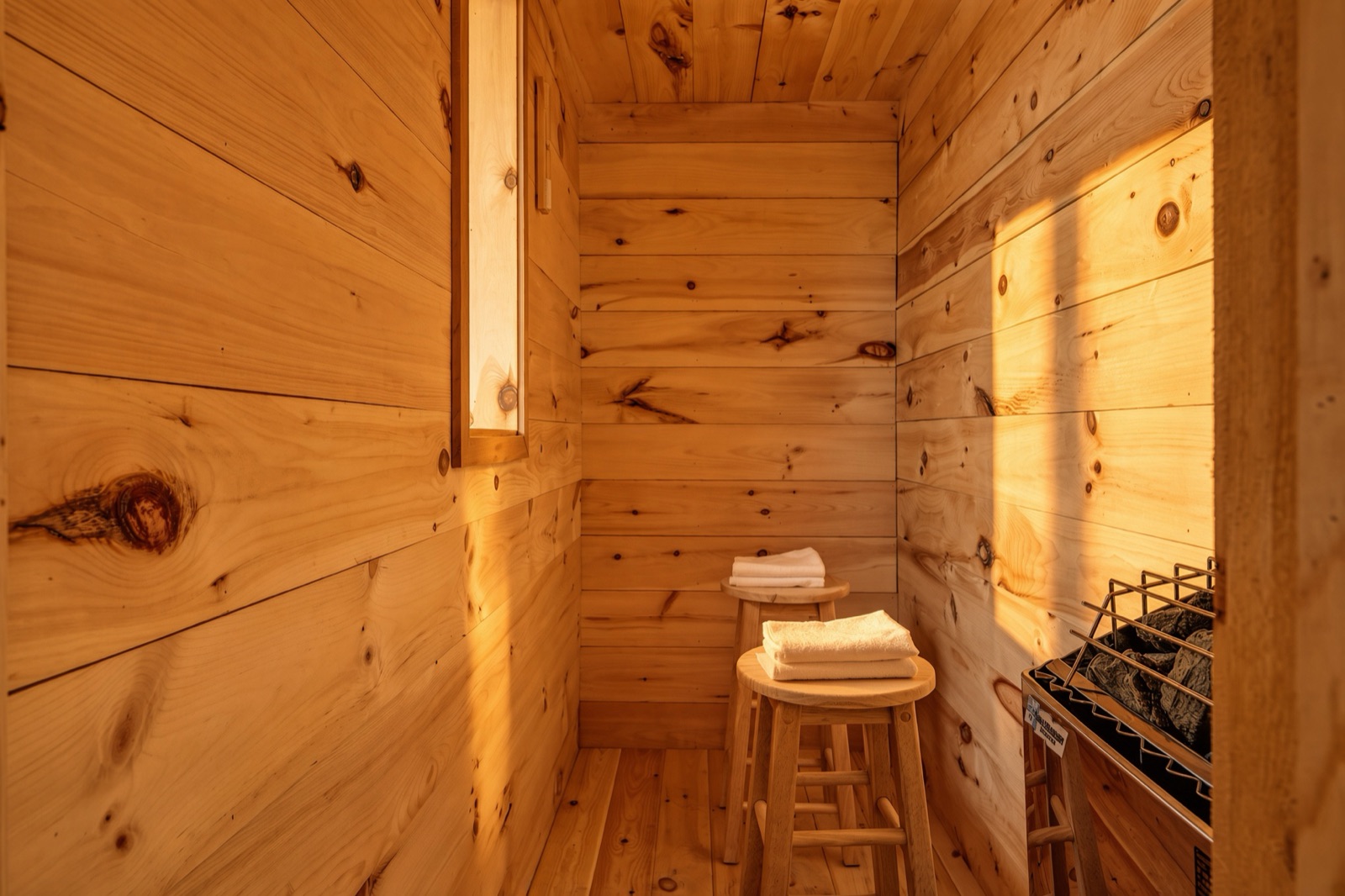 Cedar-lined Finnish sauna with folded towels